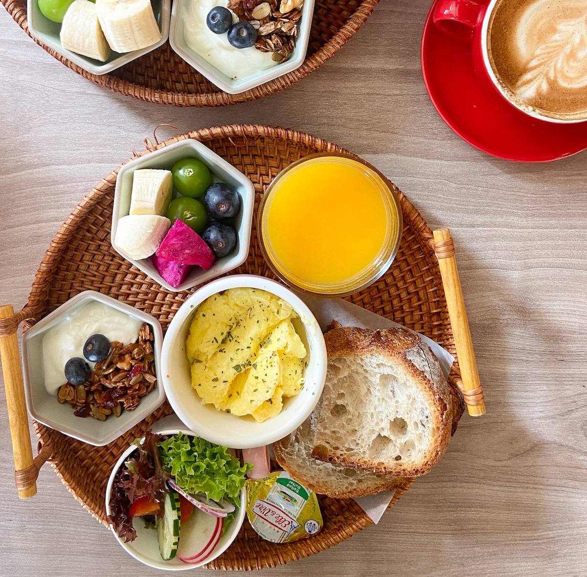 A breakfast platter served in Bubble Bee Cafe with orange juice, scrambled eggs