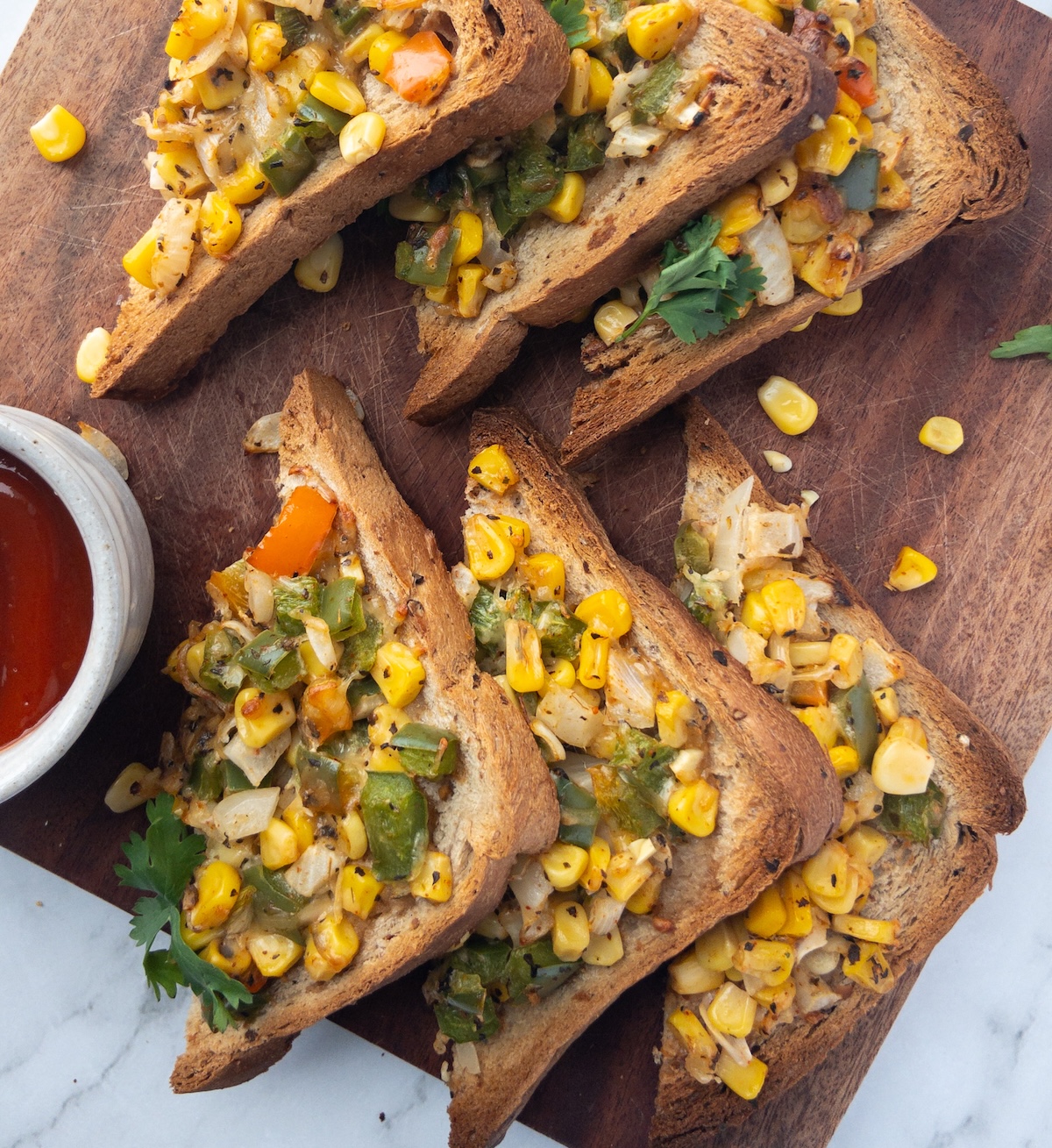 Cheese Corn toast on a wooden board