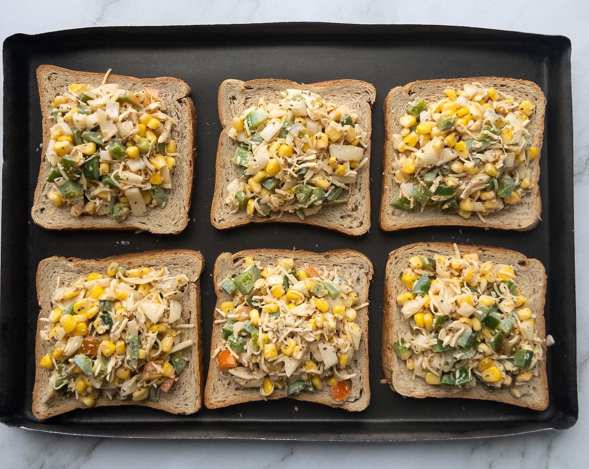 Corn toast before baking in the oven placed in a tray