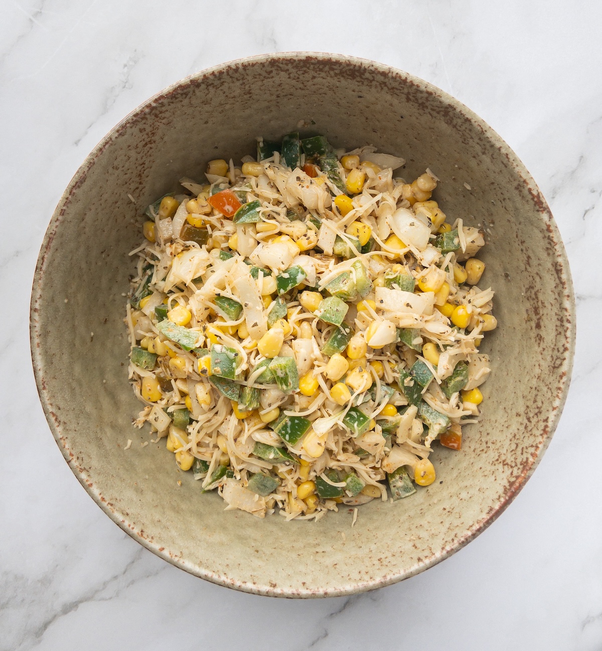 Ingredients for a corn toast recipe in a bowl mixed