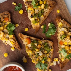 Cheese Corn toast on a wooden board