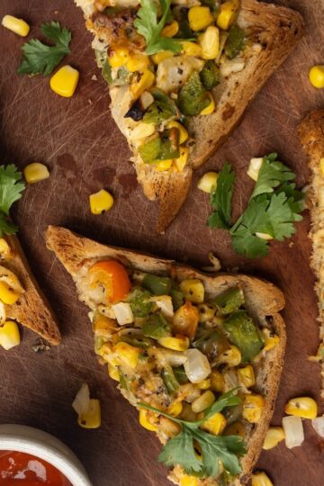 Cheese Corn toast on a wooden board