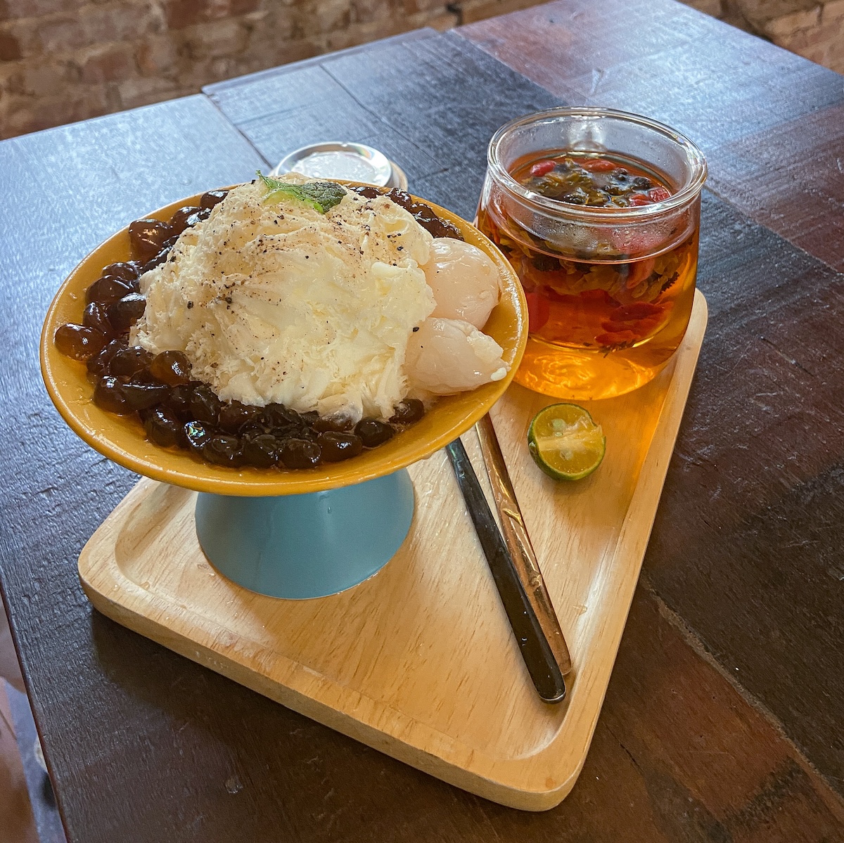 Shaved snow served with hot tea