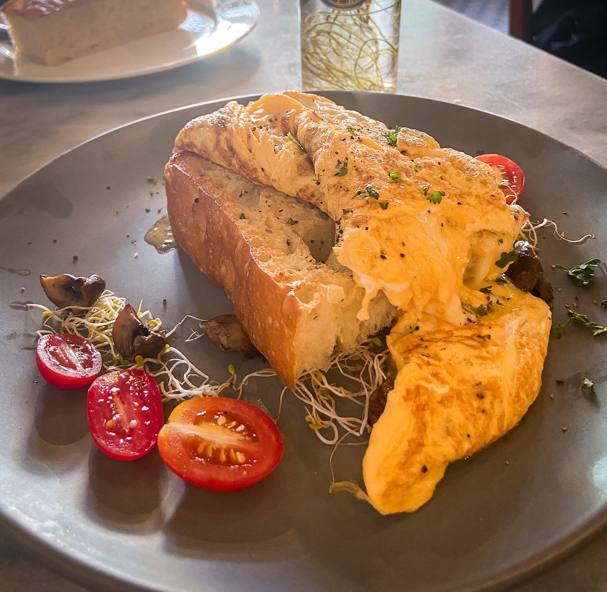 Scrambled eggs and mozzarella served on a piece of sourdough bread