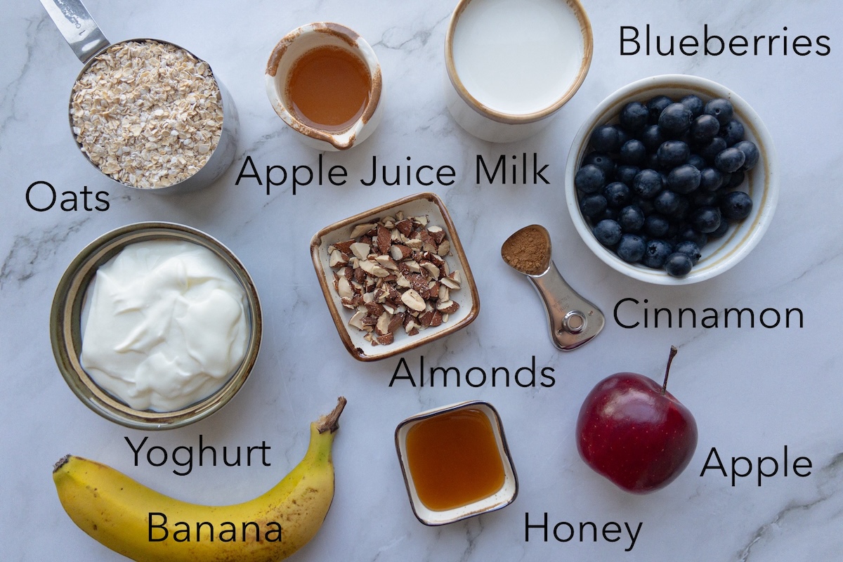 Bircher muesli ingredients in bowls on a table