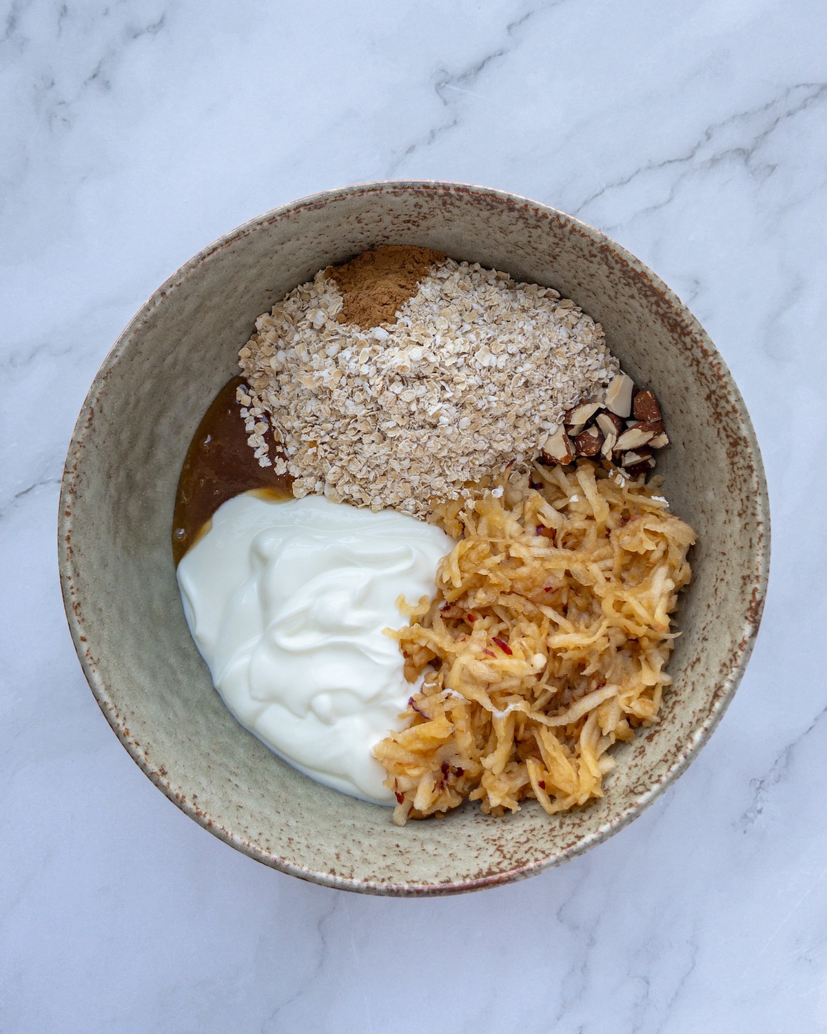 Bircher muesli ingredients in a bowl