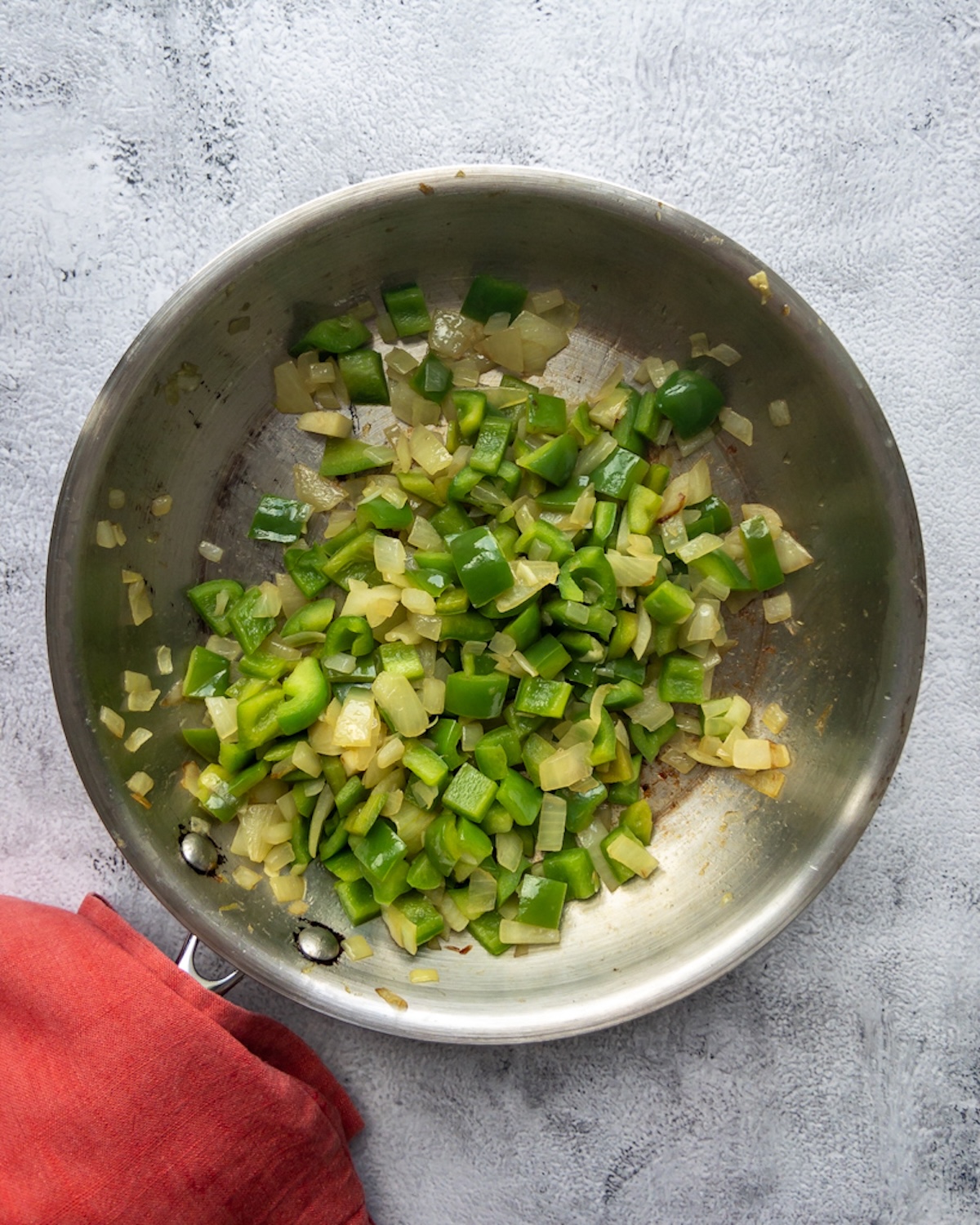 Menemen being made with onions, and peppers