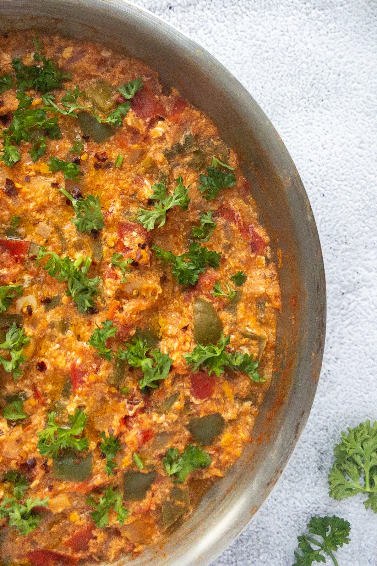 A close up of Menemen served in a steel pan
