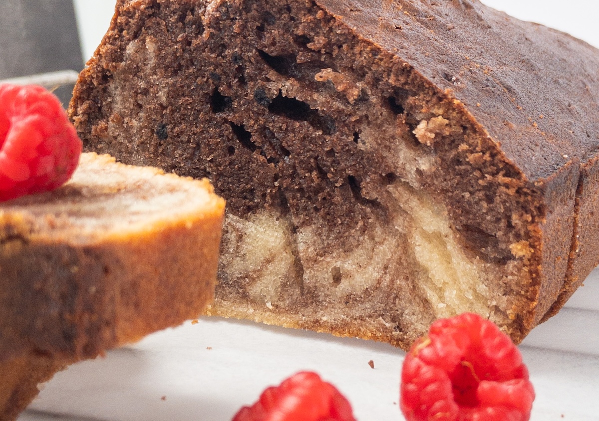 Close up of Vanilla and chocolate marbled cake slices on a wooden board