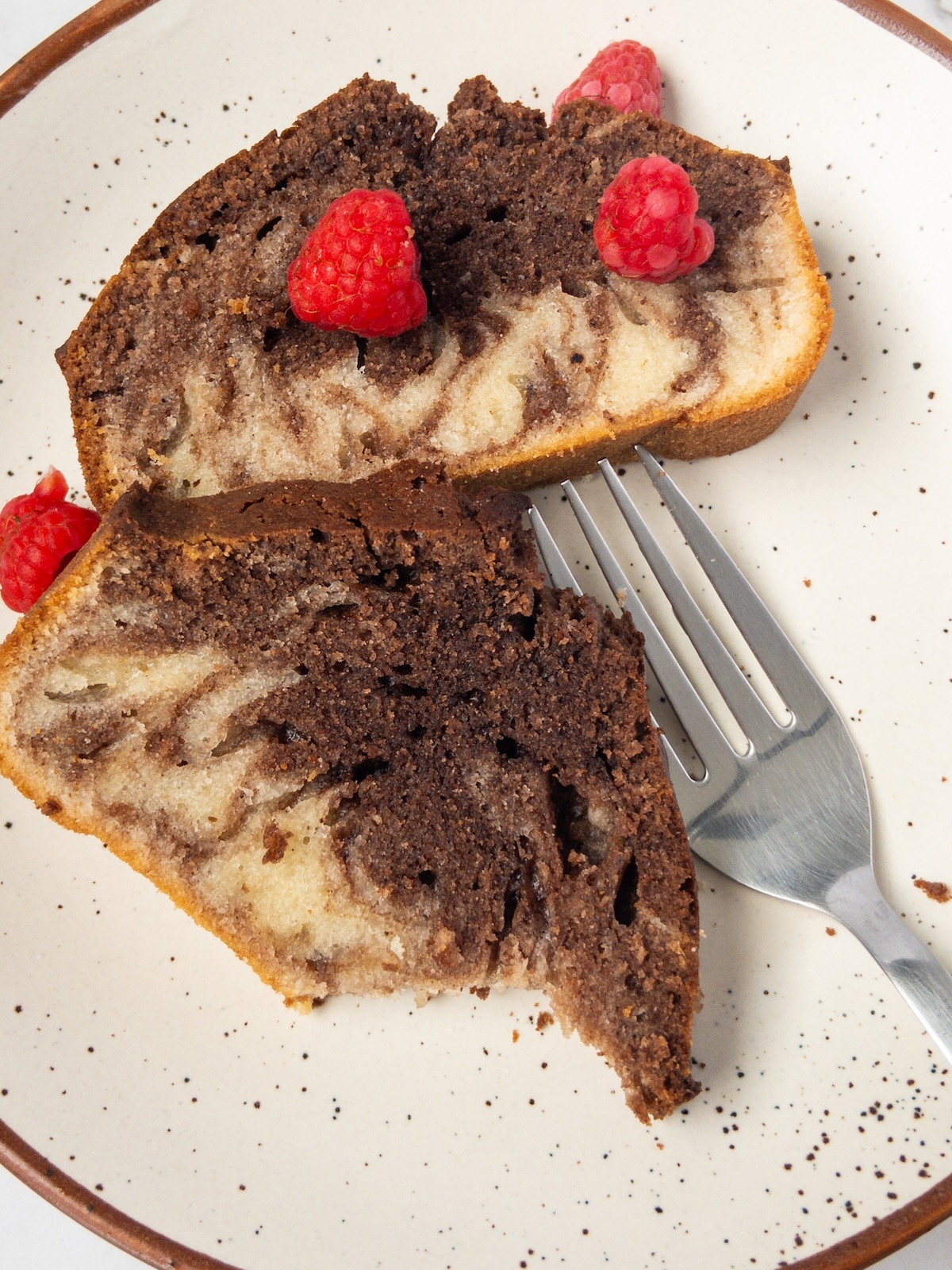 Vanilla and chocolate marbled cake slices on a plate