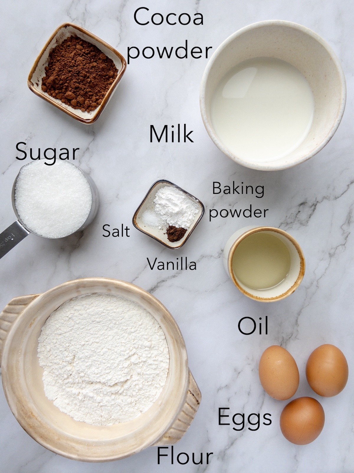Vanilla and chocolate marbled cake ingredients in a bowl