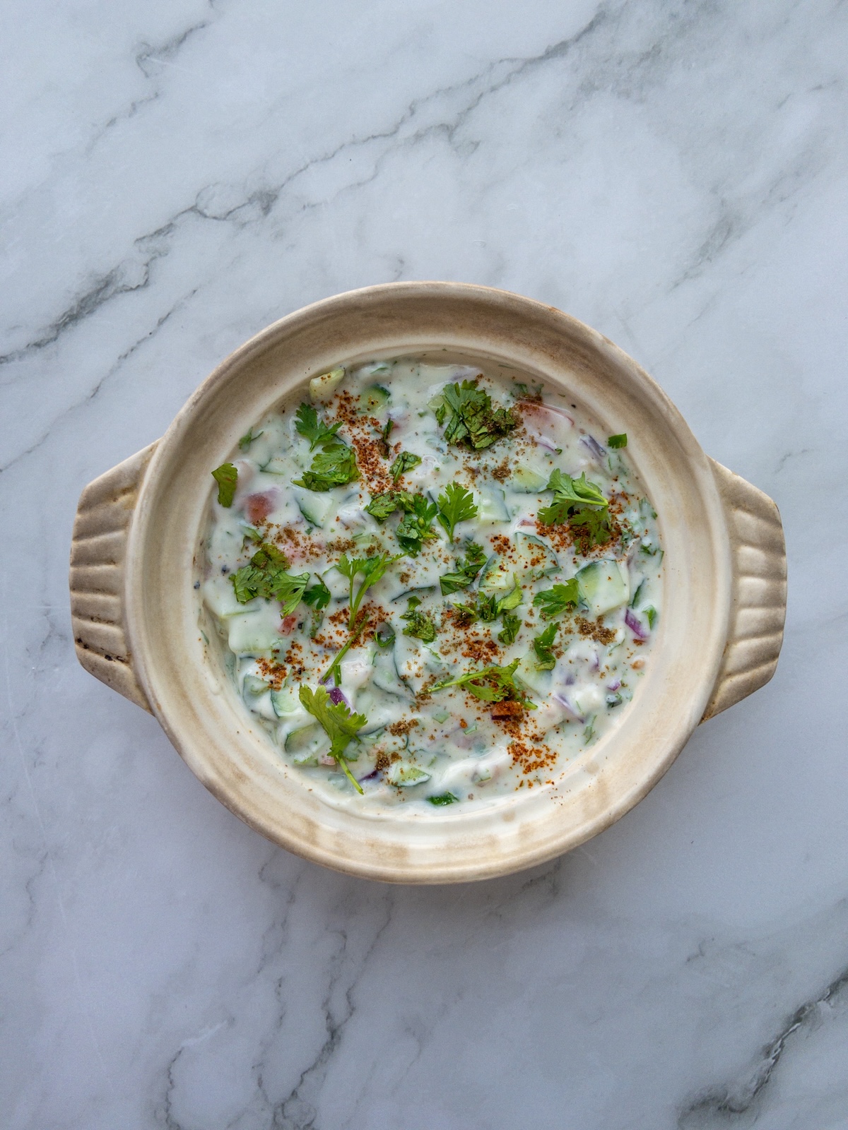 Mixed vegetable raita served in a bowl