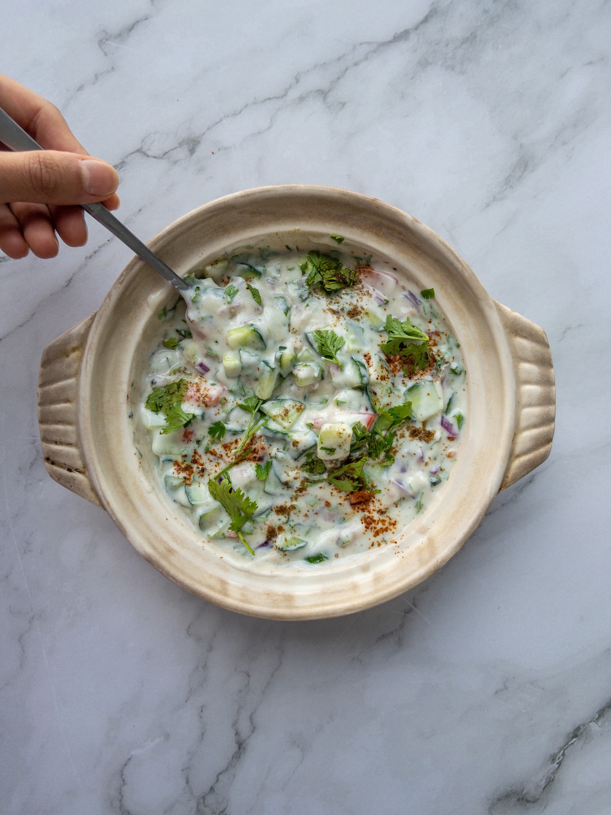 Mixed vegetable raita served in a bowl