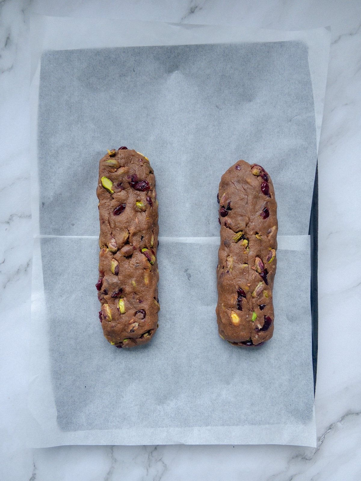 Pistachio and Cranberry Biscotti seen on a baking sheet before baking in logs