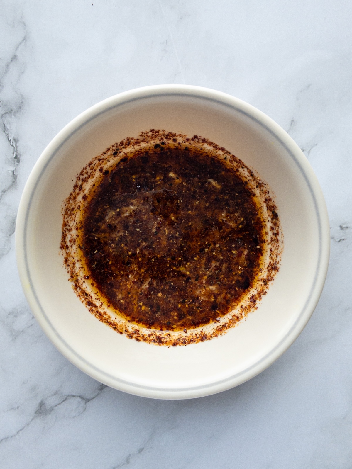 Lemon and garlic dressing with sumac in a bowl