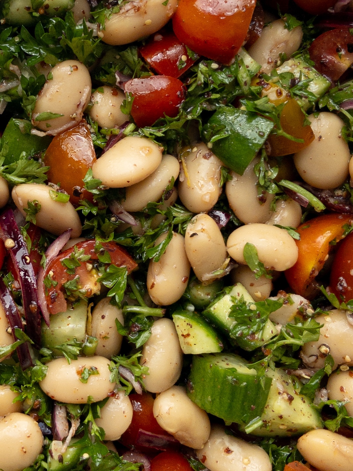 close up of butter beans mixed with vegetables