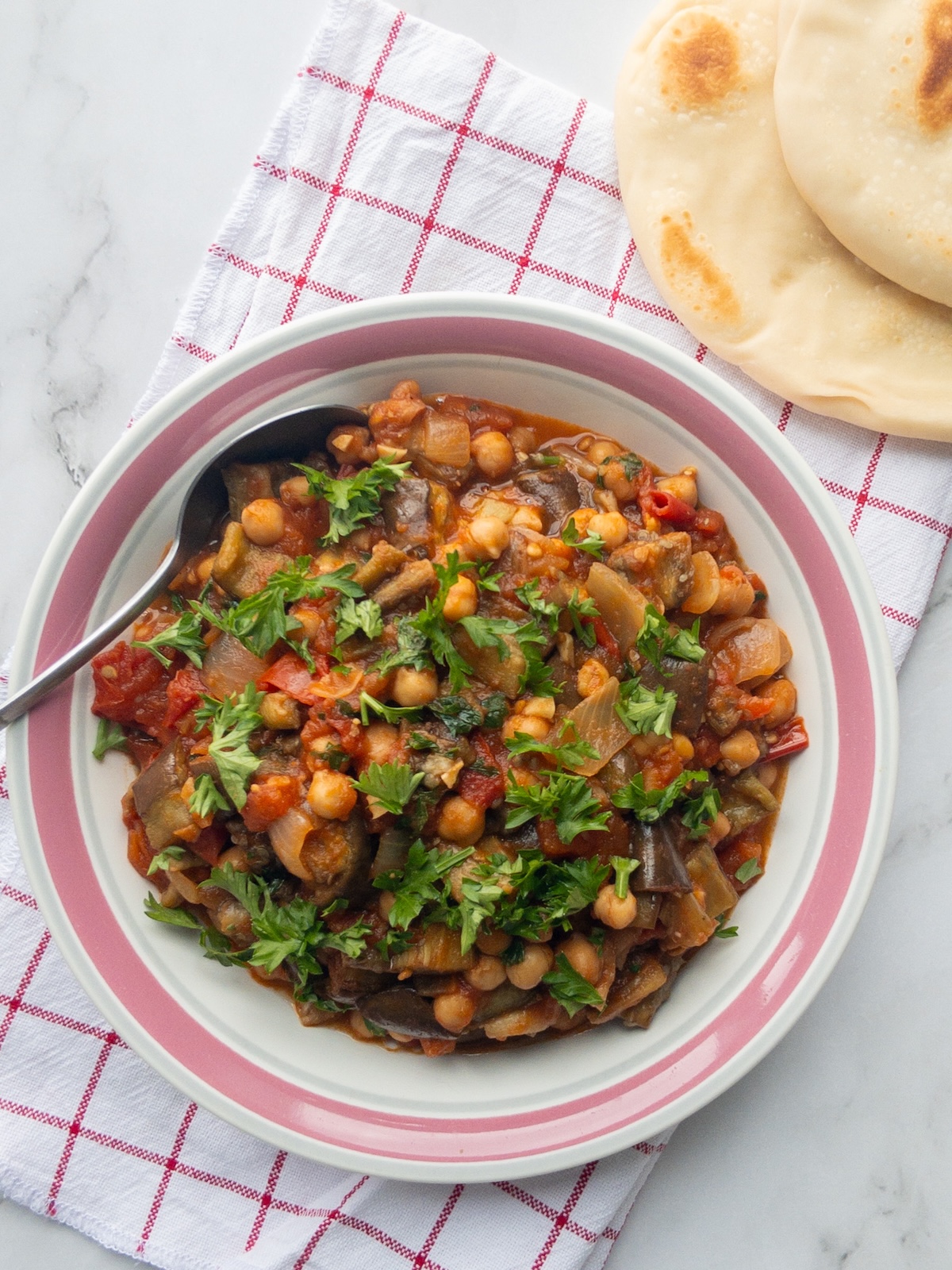 Maghmour, or Lebanese Moussaka served in a bowl with pita bread