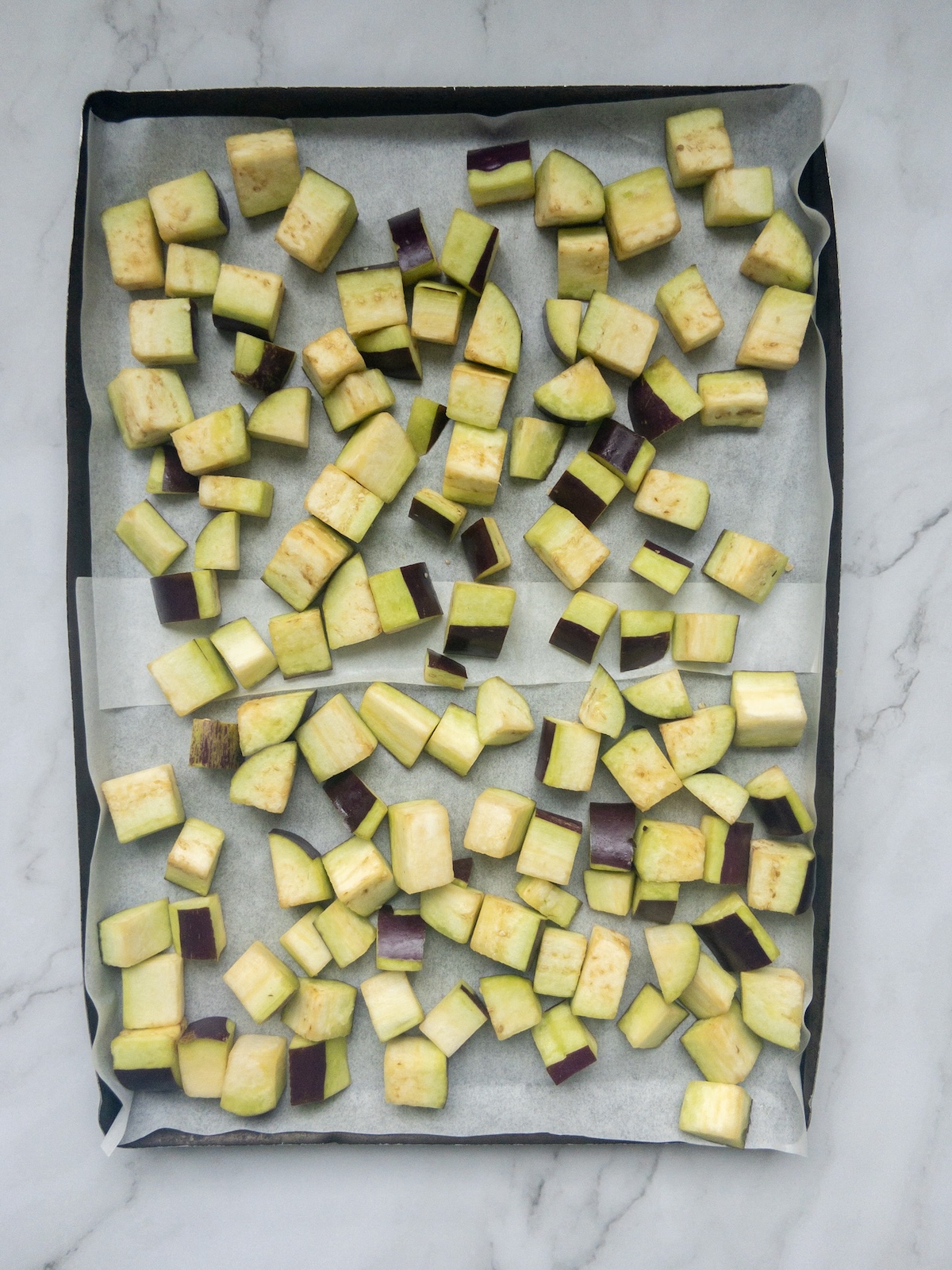 eggplant chopped in cubes and put in a tray