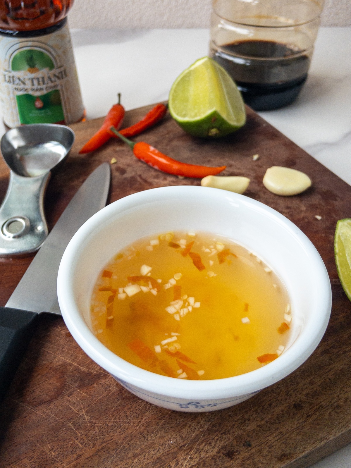 vegan nuoc cham served on a wooden chopping board