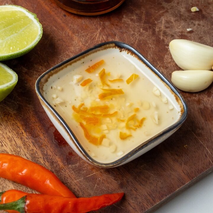 vegan nuoc cham served in a little bowl on a wooden board