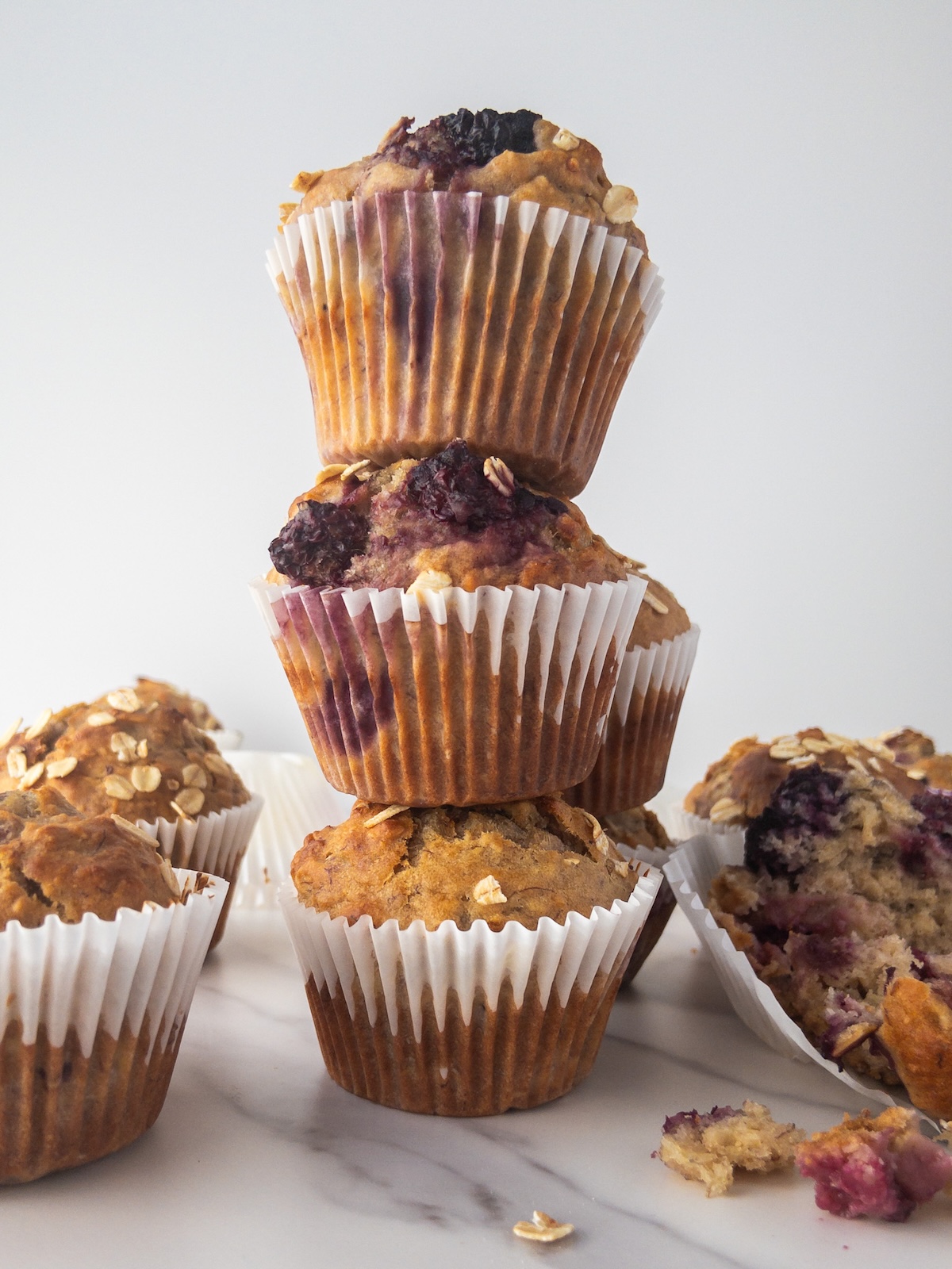 Banana and blackberry muffins stacked together