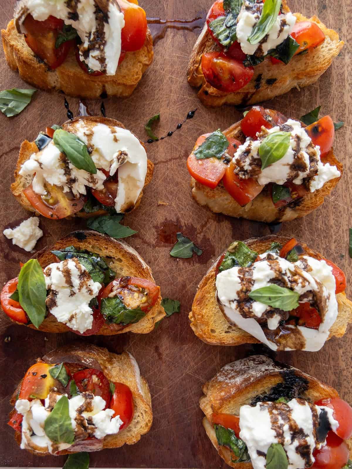 Burrata Bruschetta on a wooden chopping board